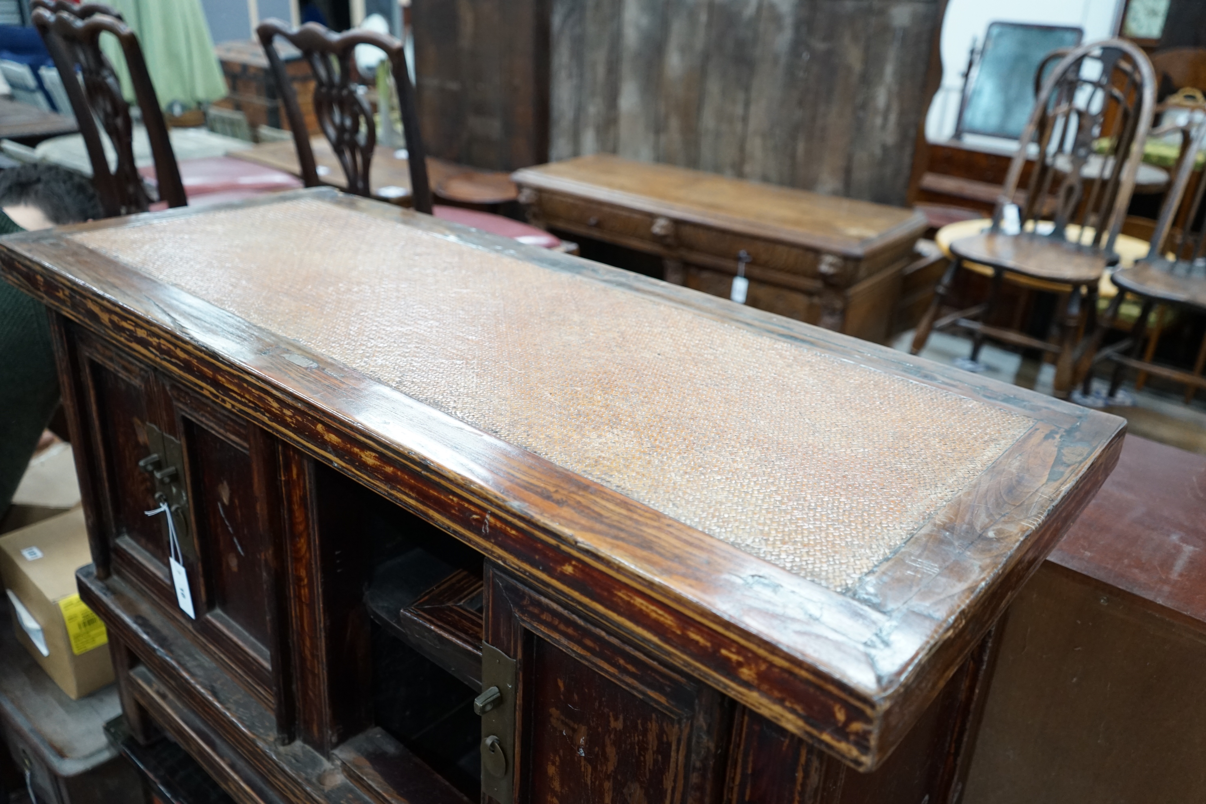 A Chinese caned pine low cabinet, width 116cm depth 48cm height 76cm